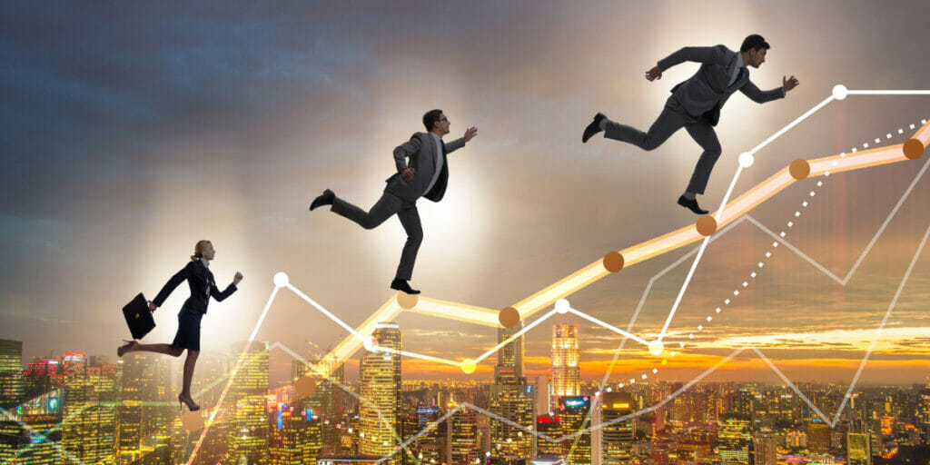 Three businesspeople in suits climb along an upward graph line over a city skyline at sunset, symbolizing progress and career growth.