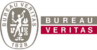 Bureau Veritas logo featuring an emblem with a figure and the text Bureau Veritas logo featuring an emblem with a figure and the text